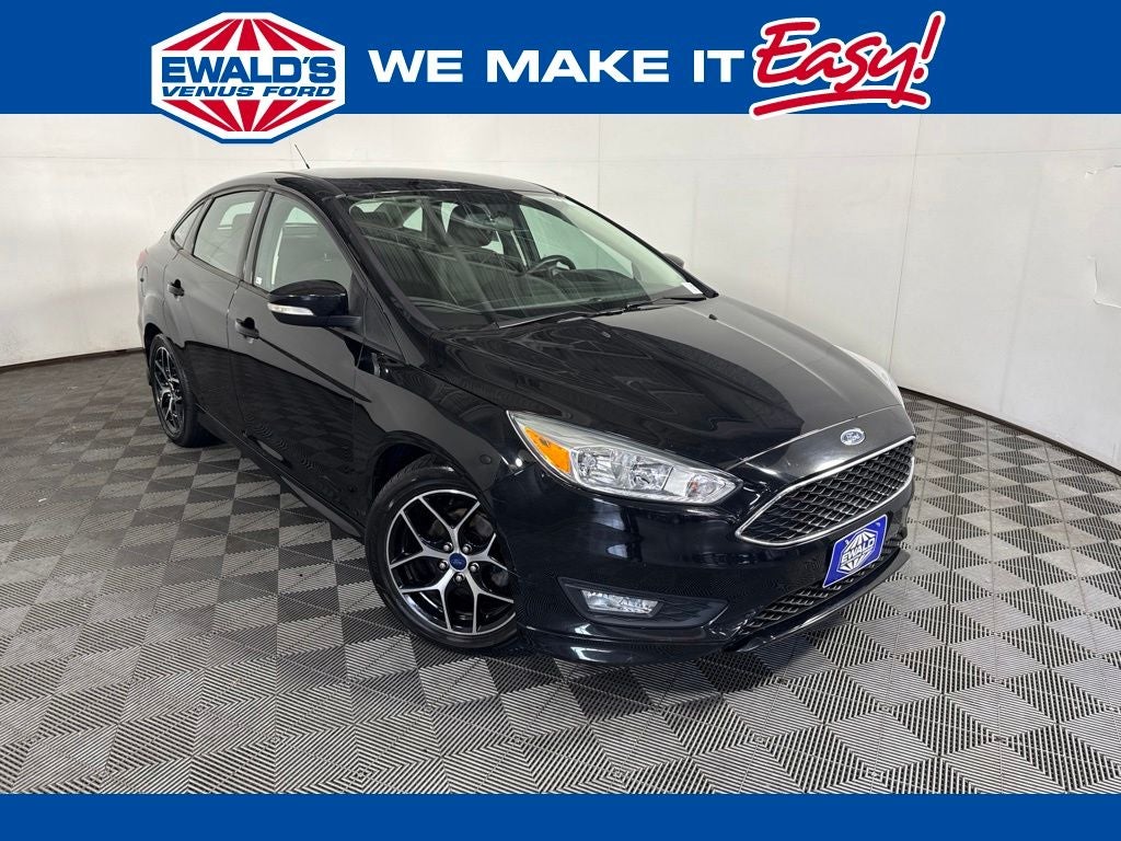 2016 Ford Focus SE in Shadow Black — front three-quarter view